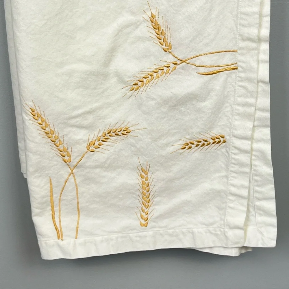Pottery Barn 100% cotton ivory with embroidered wheat tablecloth, 67” x 100”.